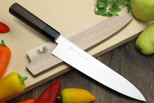 Japanese chef knife with ice-hardened stainless blade and Shitan rosewood handle