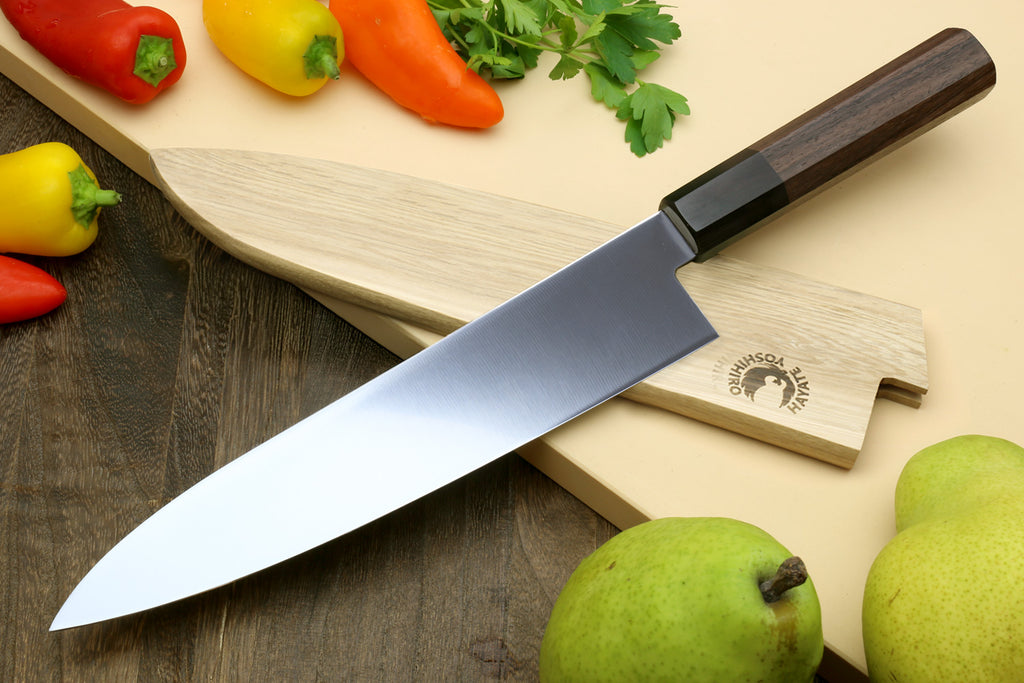 Japanese chef knife with stainless blade and Shitan rosewood handle, three-quarter view