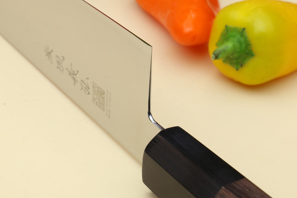Japanese chef knife blade tip and Shitan rosewood handle close-up