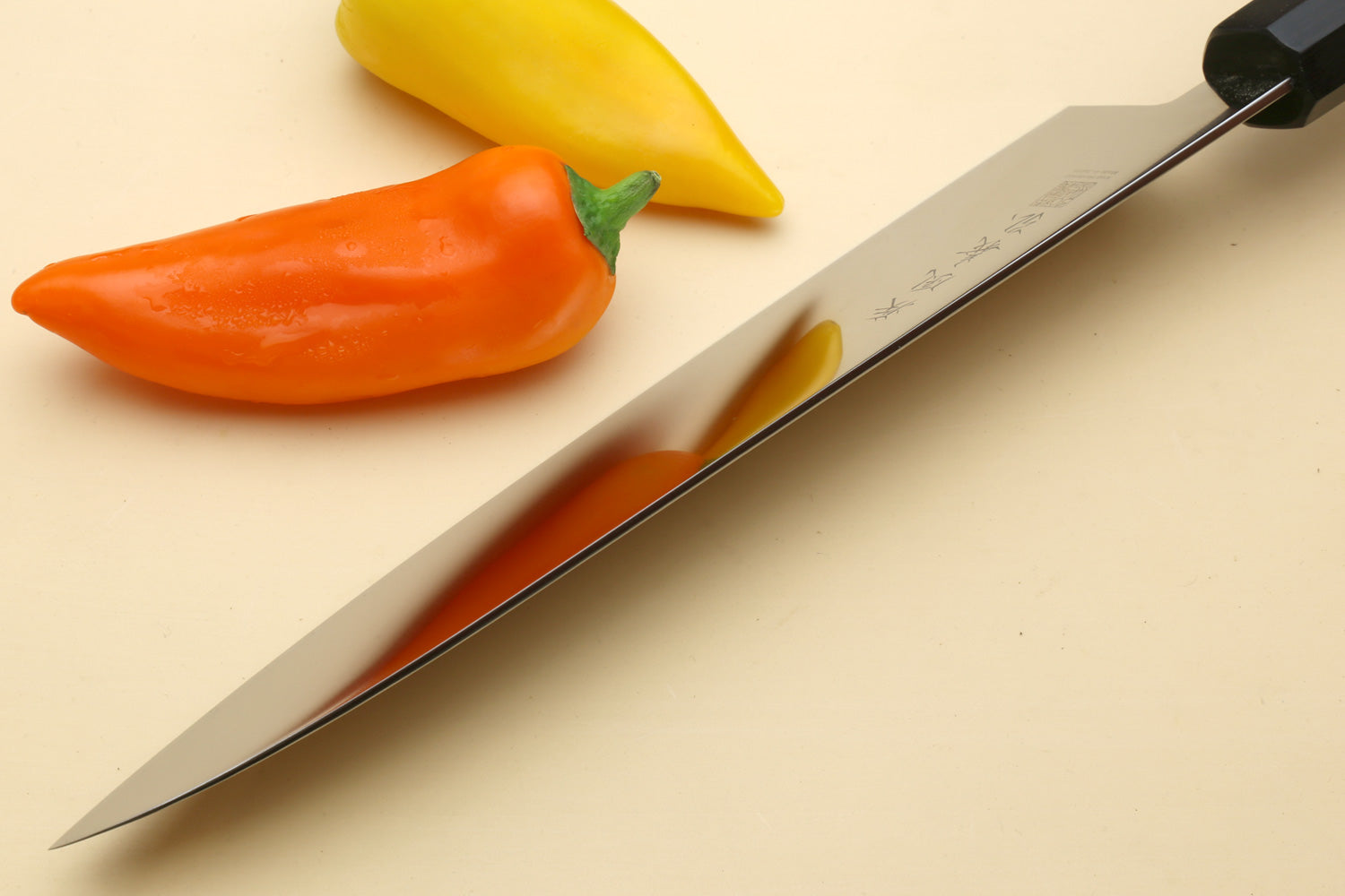 Japanese chef knife with long stainless blade and Shitan rosewood handle