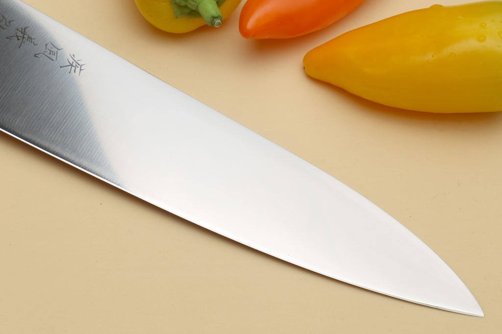 Japanese chef knife close-up of stainless blade edge and cutting face