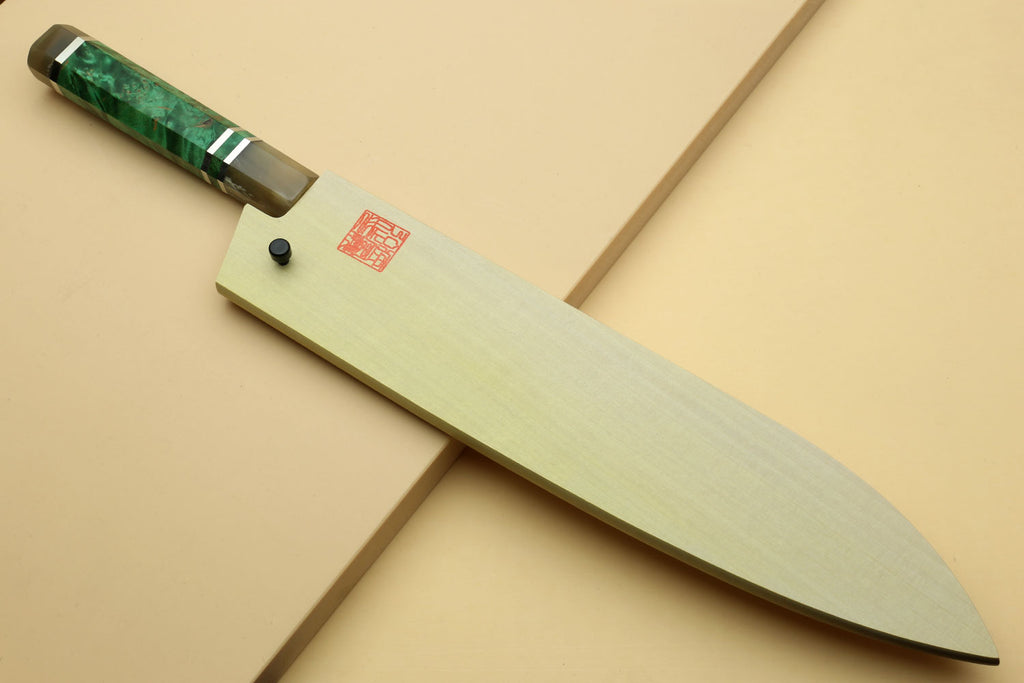 Damascus gyuto chef knife with dark green handle and wavy Damascus blade, side view