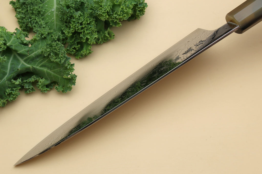 Damascus gyuto knife with long pointed blade and dark green handle, side profile