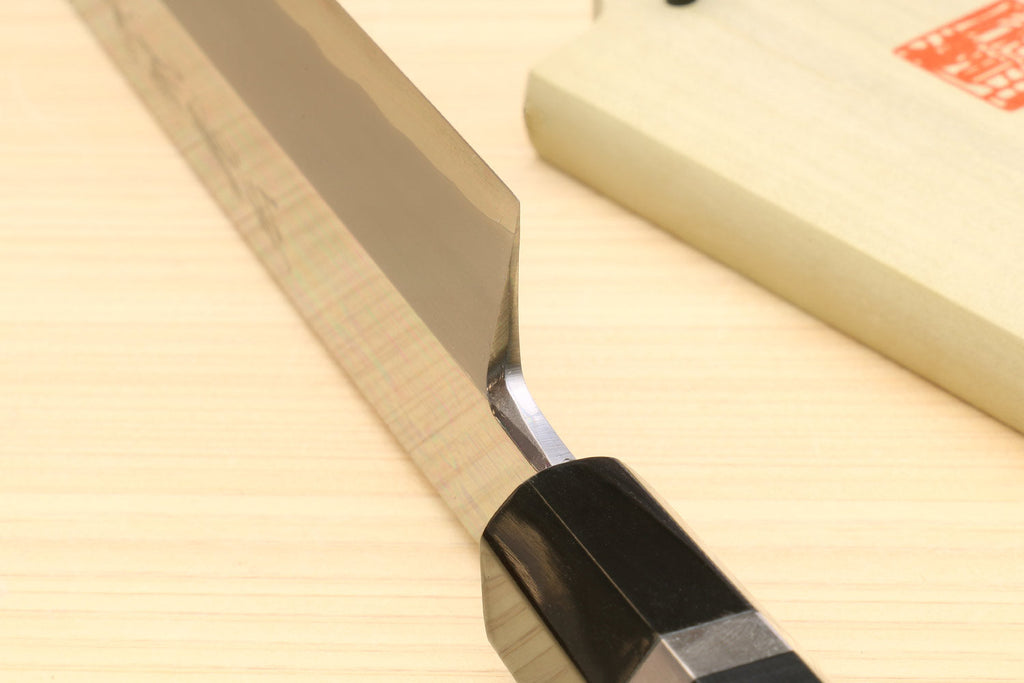 Tuna knife tip and edge detail with mirror-polished steel blade and ebony handle