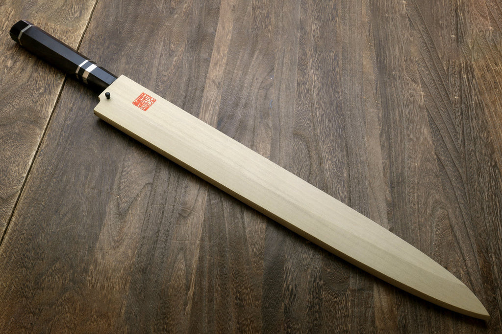 Yanagi-style tuna knife with long mirror-polished steel blade and ebony handle with rings
