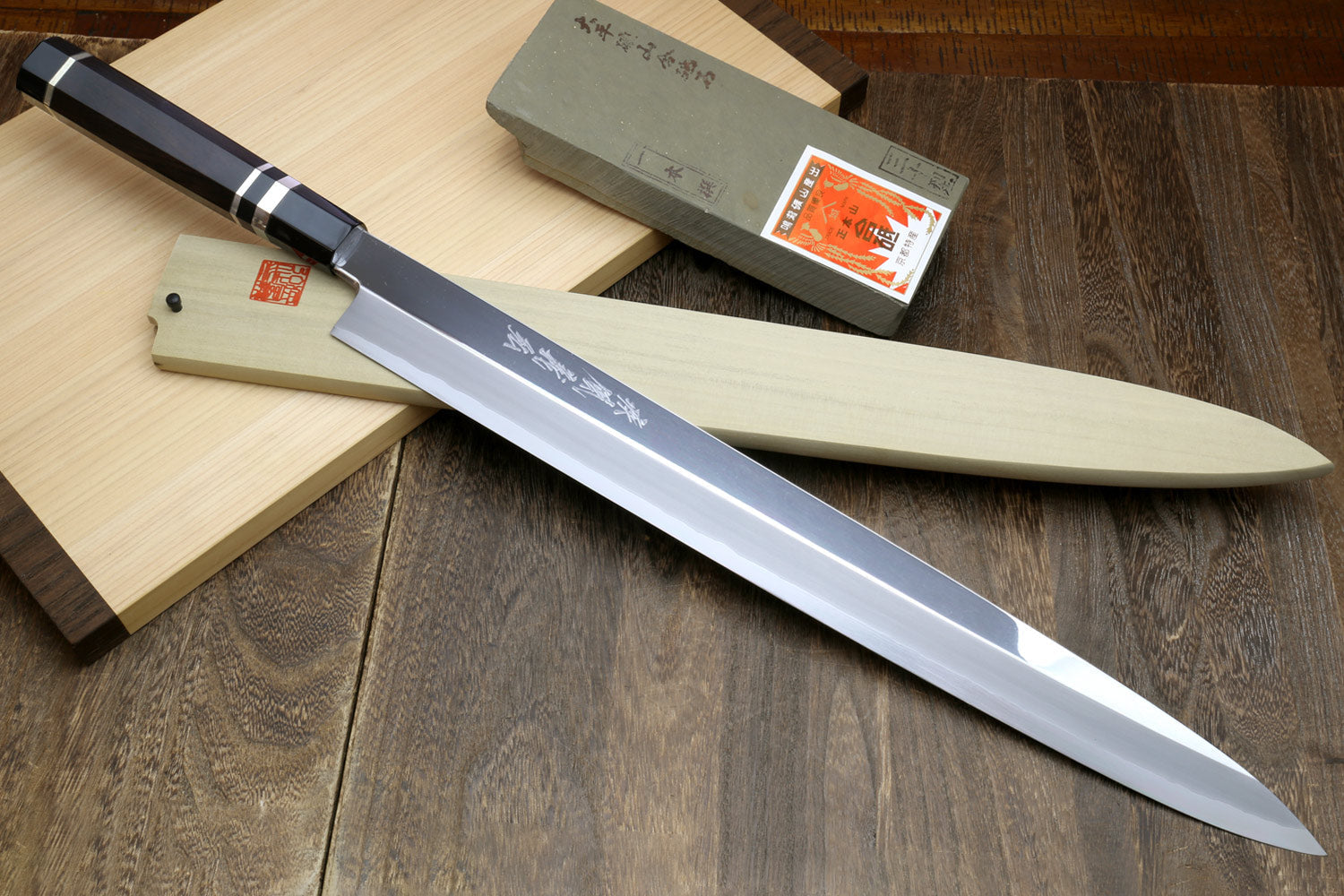 Mirror-polished tuna knife with ebony handle and triple silver rings