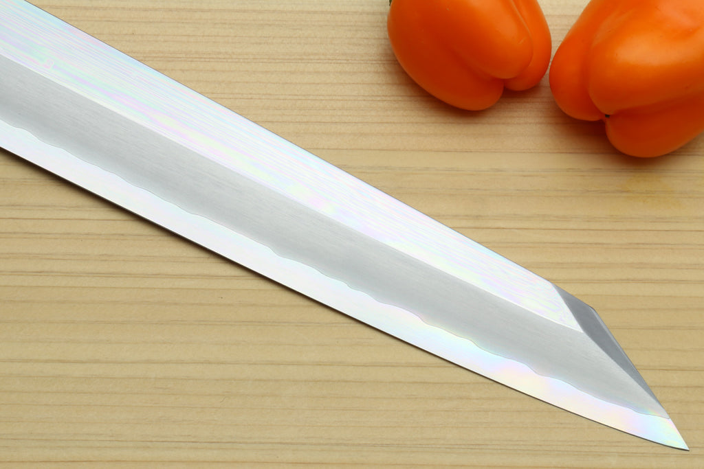 Mirror-polished Yanagi kiritsuke knife blade with pointed tip and dark handle
