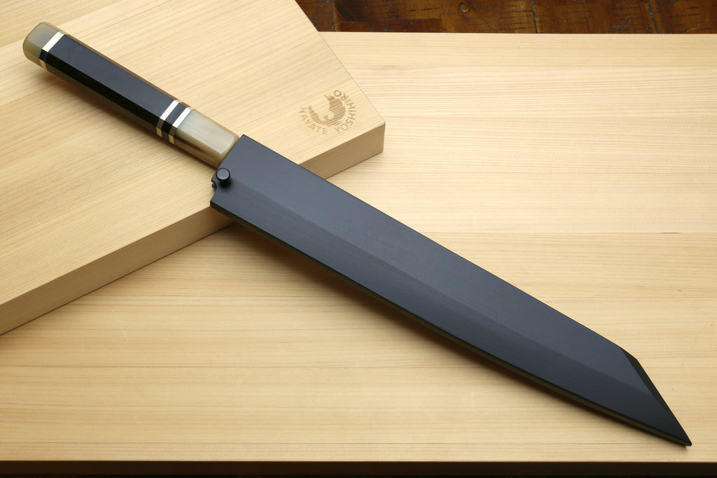 Sushi yanagiba knife with dark sheath, mirror stainless blade, ebony handle on wooden stand