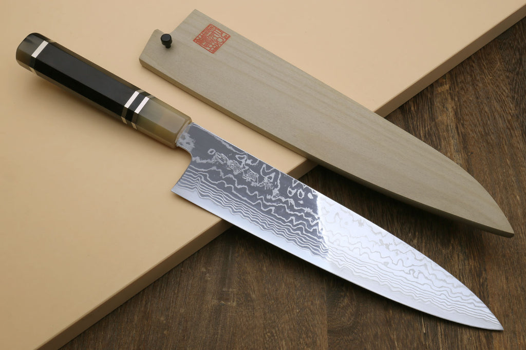 Damascus gyuto chef knife with octagonal ebony handle, triple-ring bolster, wavy blade