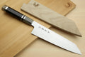 Kiritsuke chef knife with ebony handle and two wooden display blocks