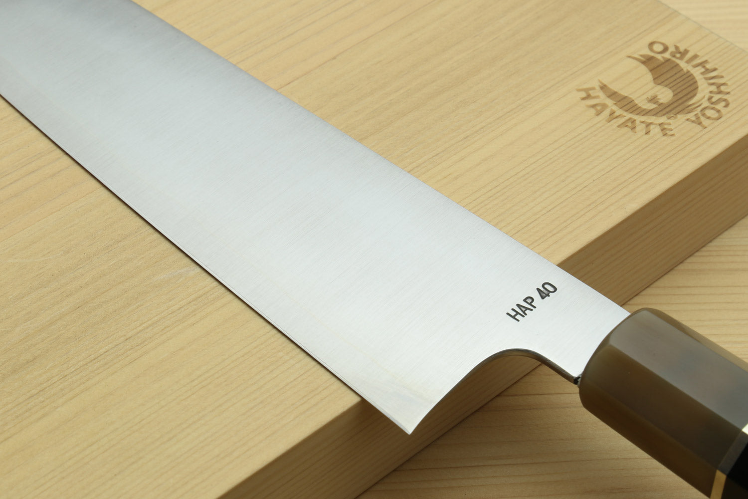 Kiritsuke chef knife edge and handle close-up with “HAP 40” marking