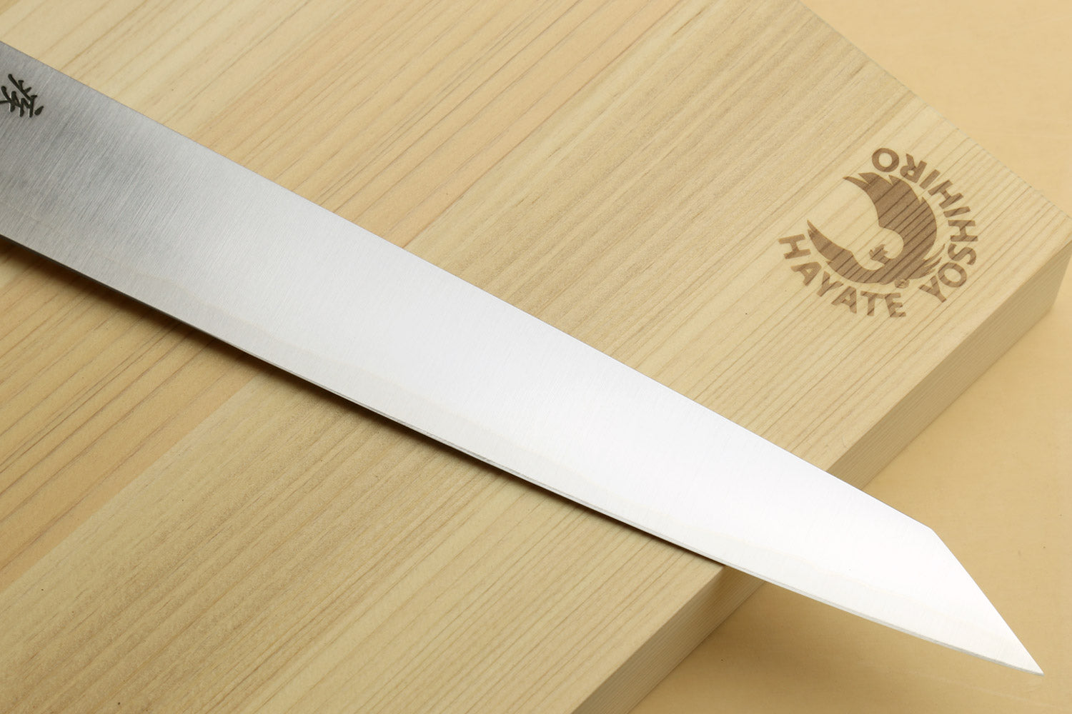 Sujihiki slicer knife with long white blade and Yoshihiro/HAP40 logo on box