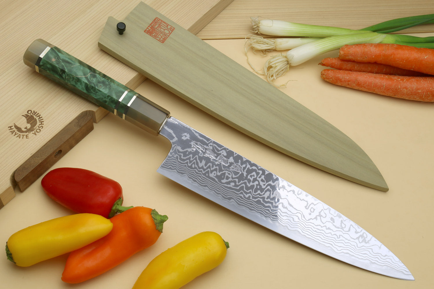 Gyuto chef knife with Damascus blade, green burl handle, and stainless bolster