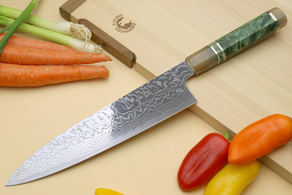 Chef's gyuto knife with gray Damascus-pattern blade and green resin-burl handle
