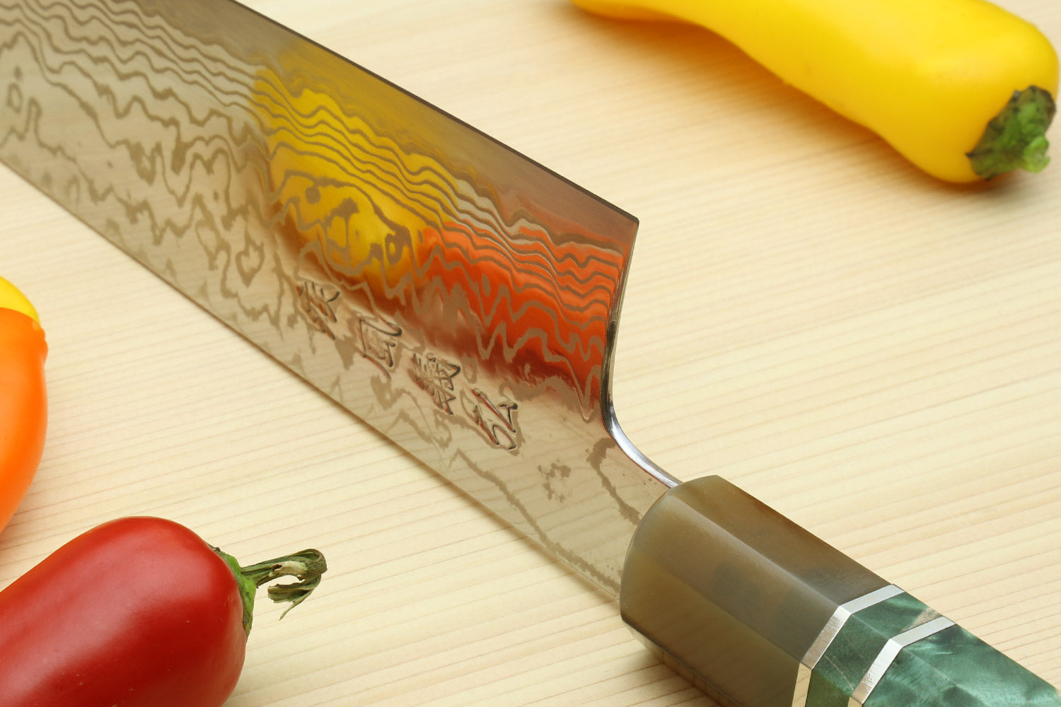 Chef's gyuto knife with rustic Damascus blade and green burl handle