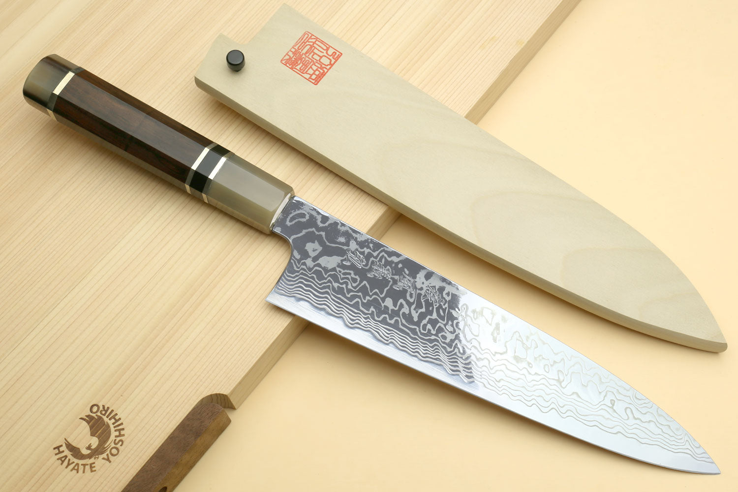 Damascus gyuto chef knife with long blade and dark octagonal handle