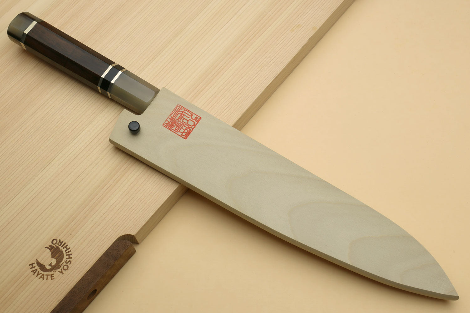 Damascus gyuto chef knife with long blade and dark octagonal handle