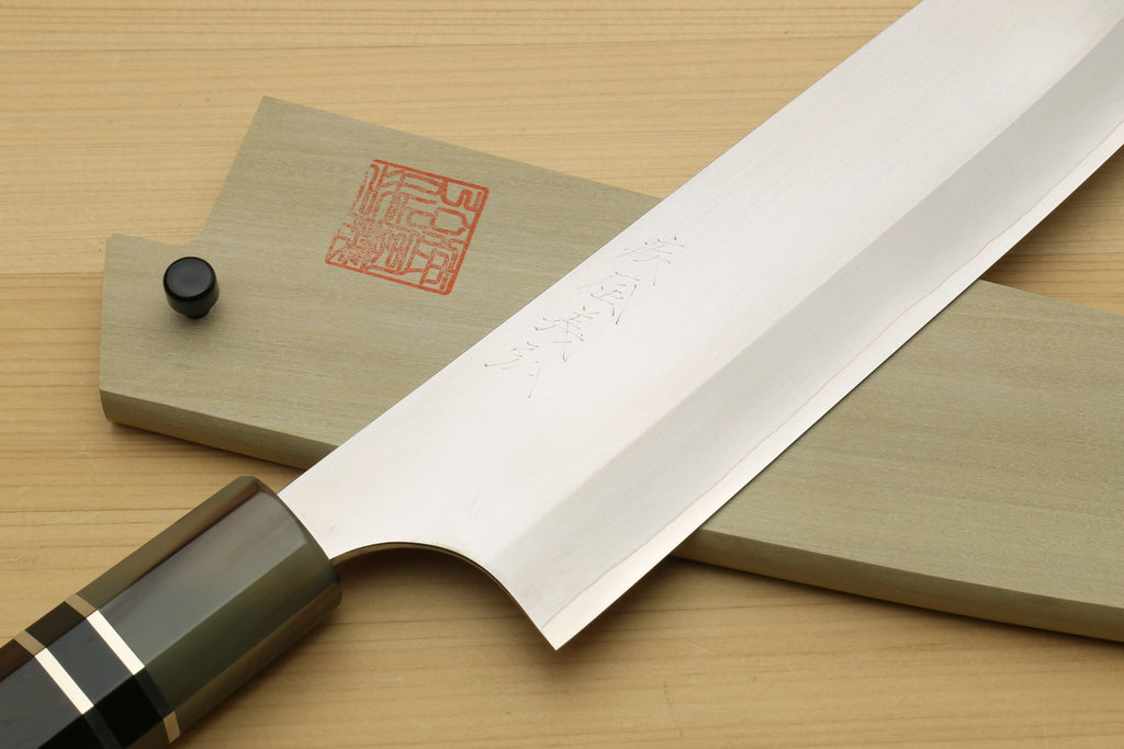 Gyuto chef knife showing white blade profile and ebony handle with black-gray ring accents