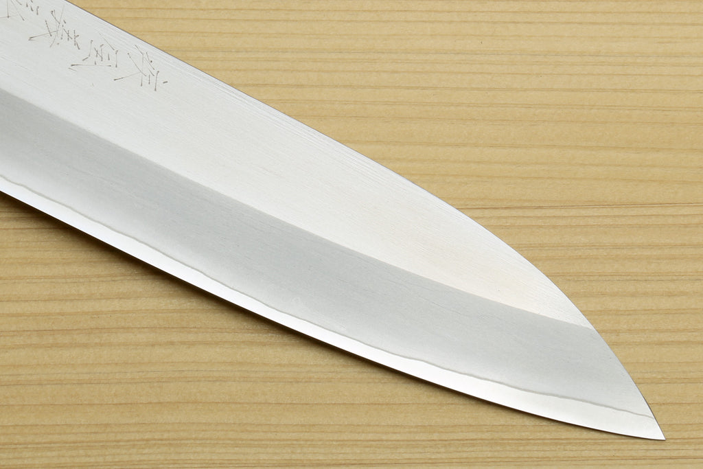 Stainless steel petty utility knife blade, long edge view