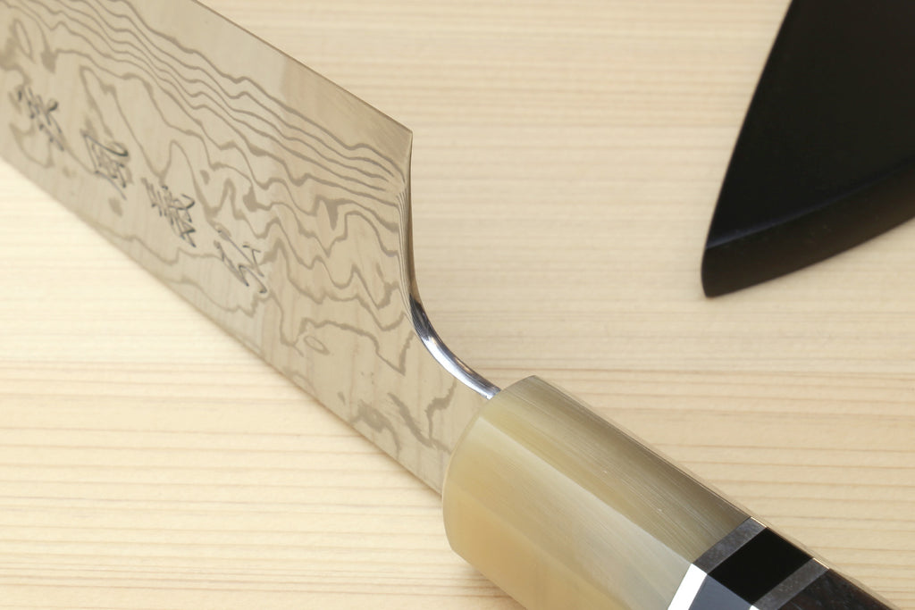 Damascus gyuto blade and octagonal handle detail with triple ring