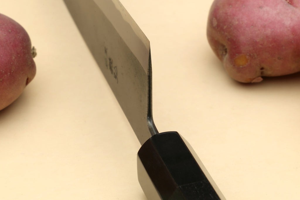 Japanese gyuto knife close-up of spine and ebony handle