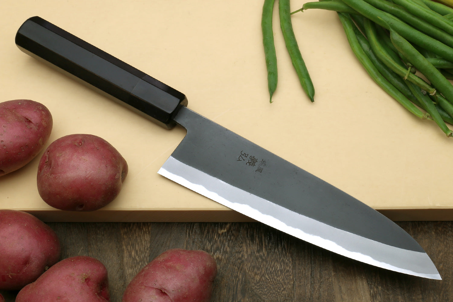 Japanese gyuto chef’s knife with dark kurouchi blade and ebony wood handle