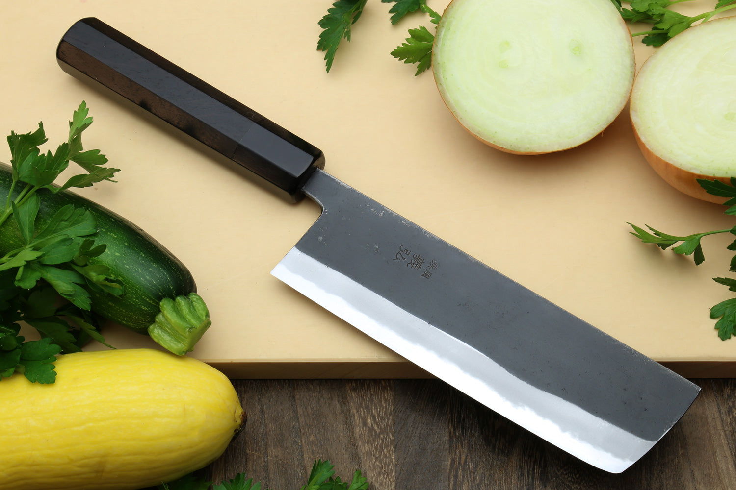Nakiri vegetable knife with dark kurouchi blade and ebony wood handle