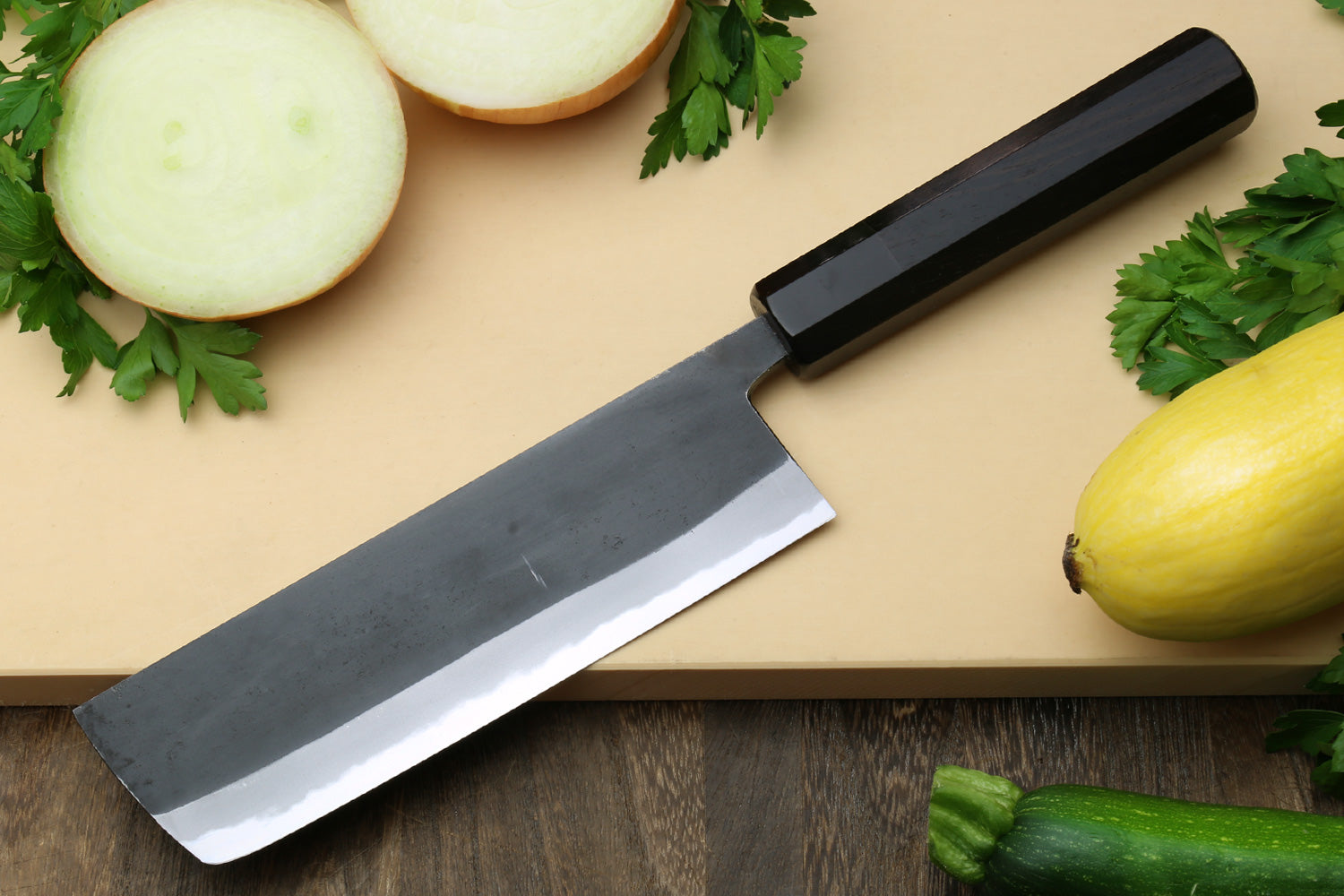 Kurouchi nakiri vegetable knife with ebony wood handle and dark steel blade