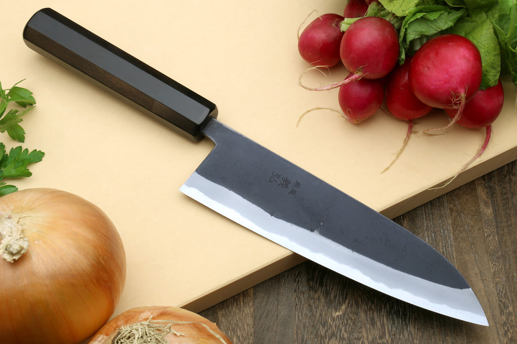 Santoku knife with dark kurouchi blade, black handle cover, edge visible