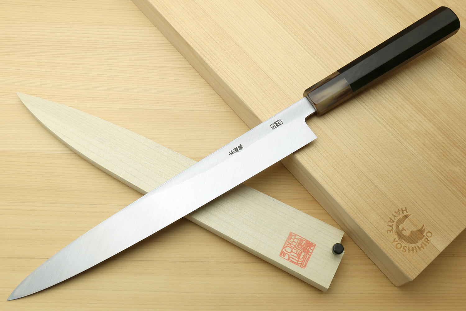 Yanagi sushi knife with white blade and dark ebony handle