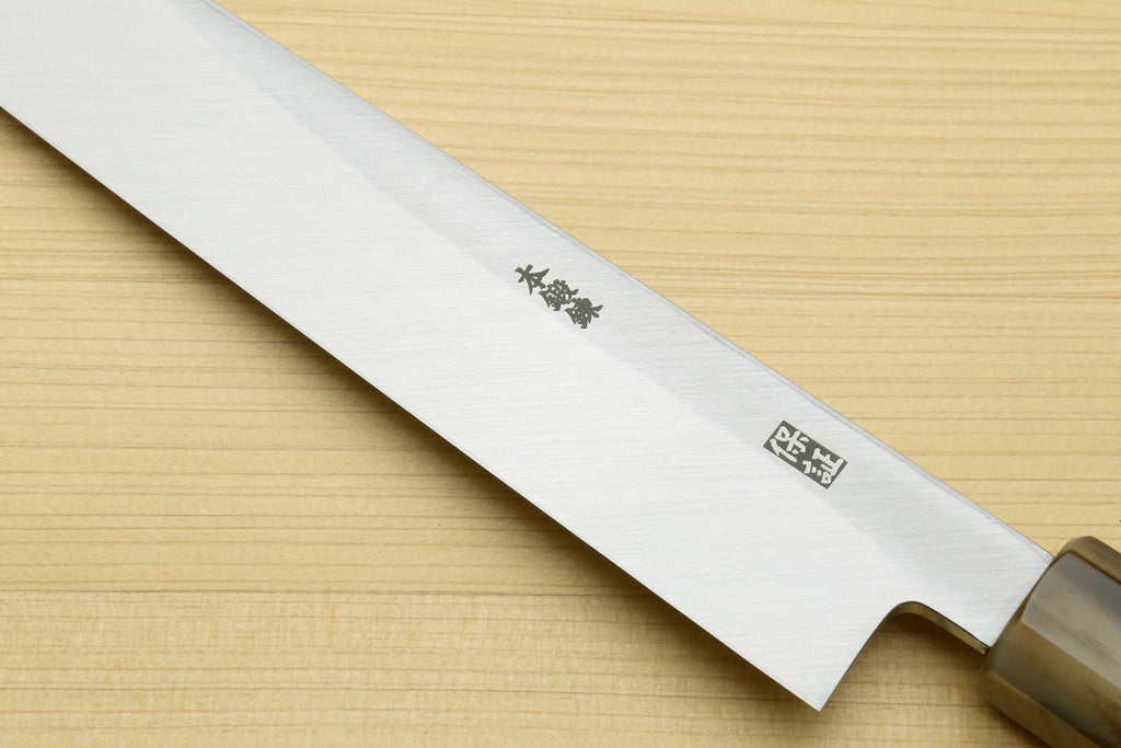 Yanagi sushi knife blade close-up with dark handle