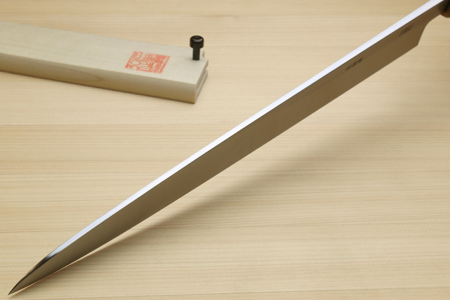 Yanagi sushi knife with long pointed blade and wooden saya