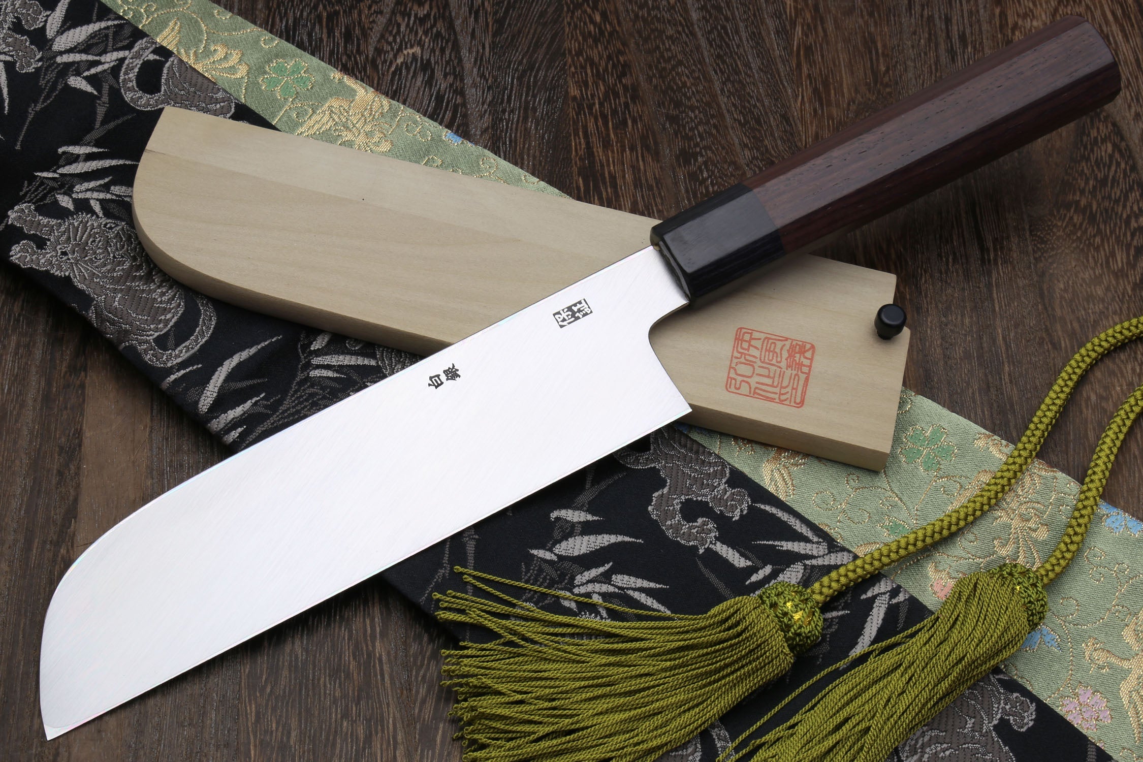 Japanese kama usuba knife with dark shitan handle and light blade, close side view.