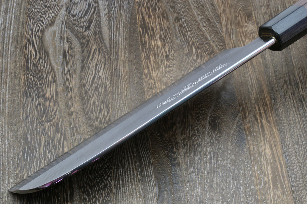 Japanese kama usuba knife with light blade and dark shitan handle, angled close view.
