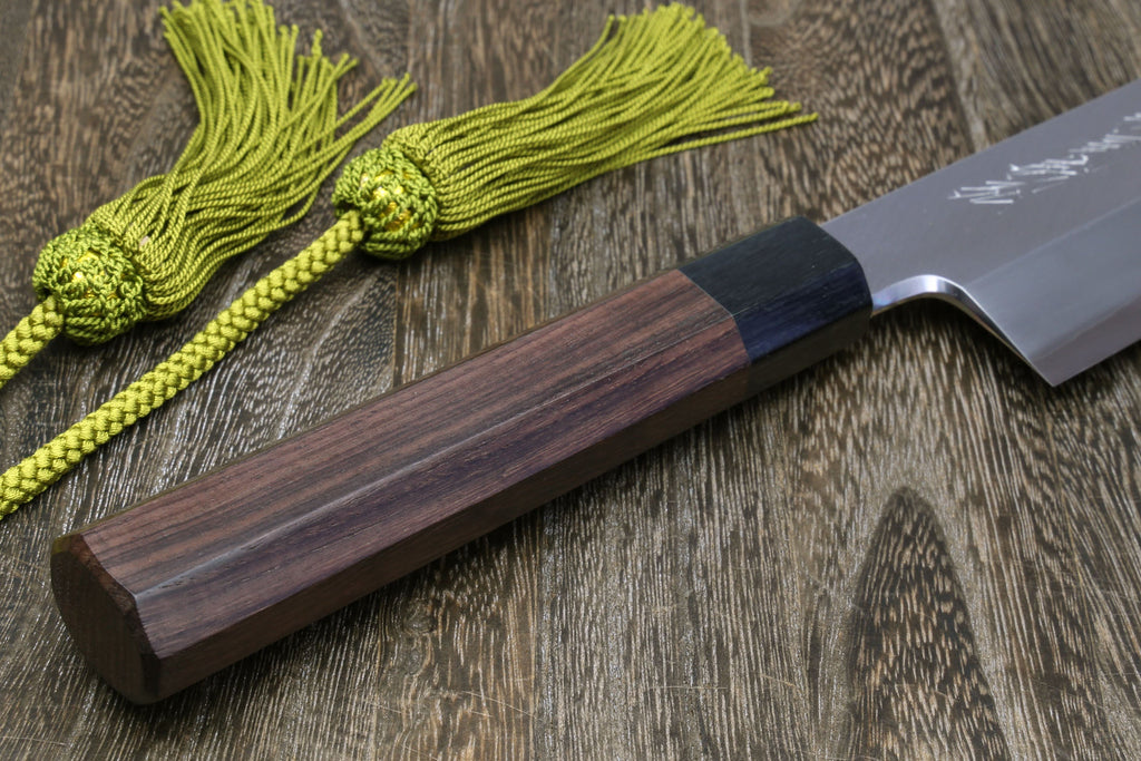 Japanese kama usuba knife with dark shitan handle and light blade, shown with cord.