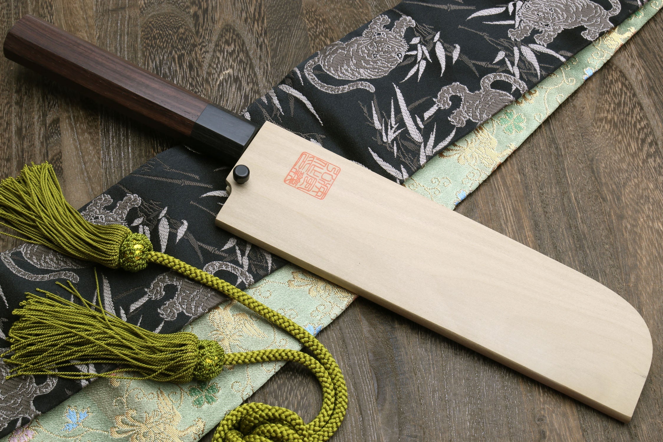 Japanese kama usuba knife with dark shitan handle and light blade, with pale saya.