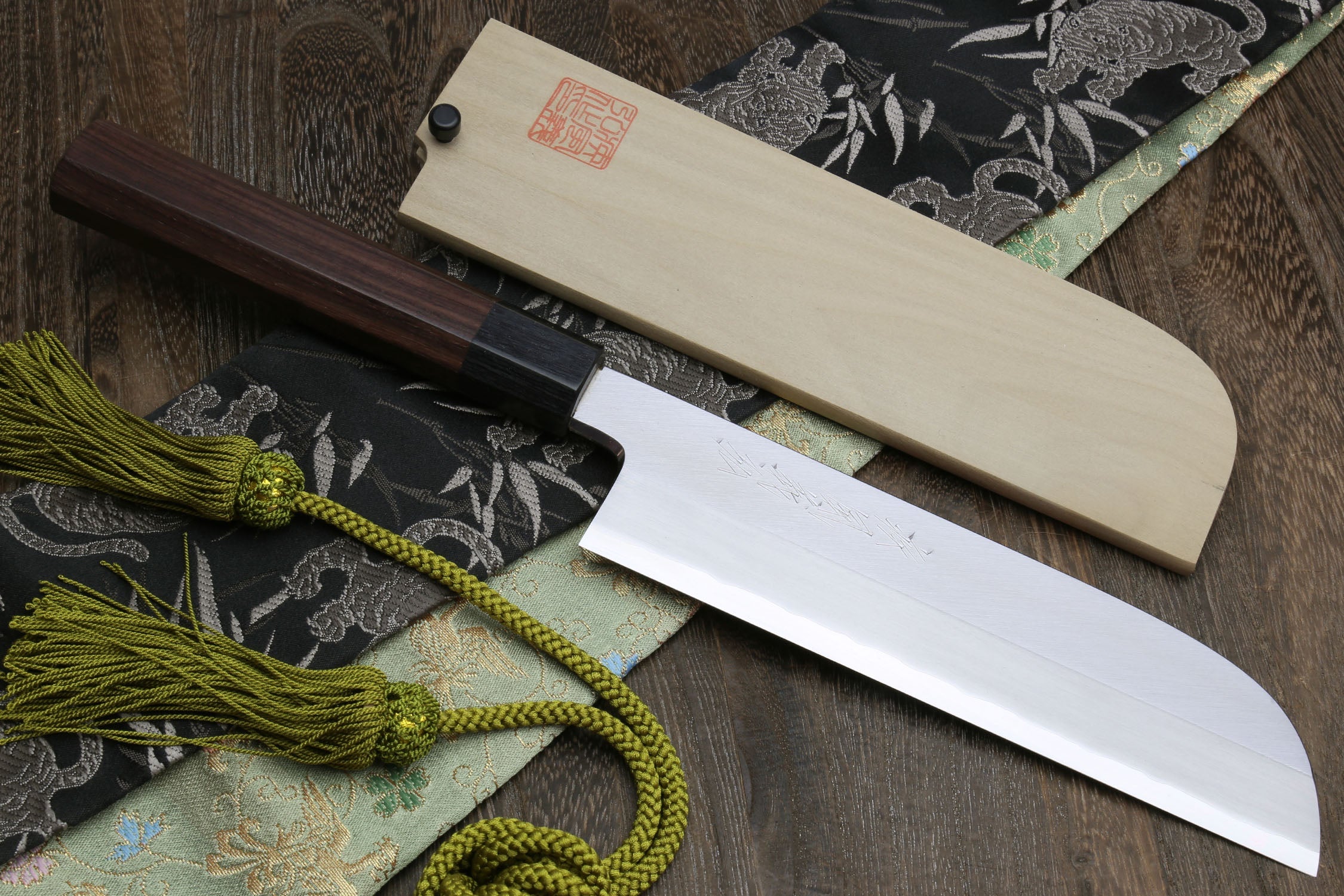 Japanese kama usuba knife with dark shitan handle, light blade, shown with pale saya.