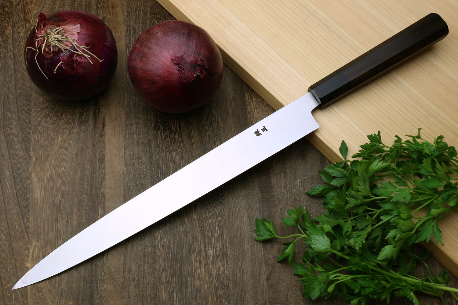 Yanagi sashimi knife with long straight, mirror-polished blade and ebony handle