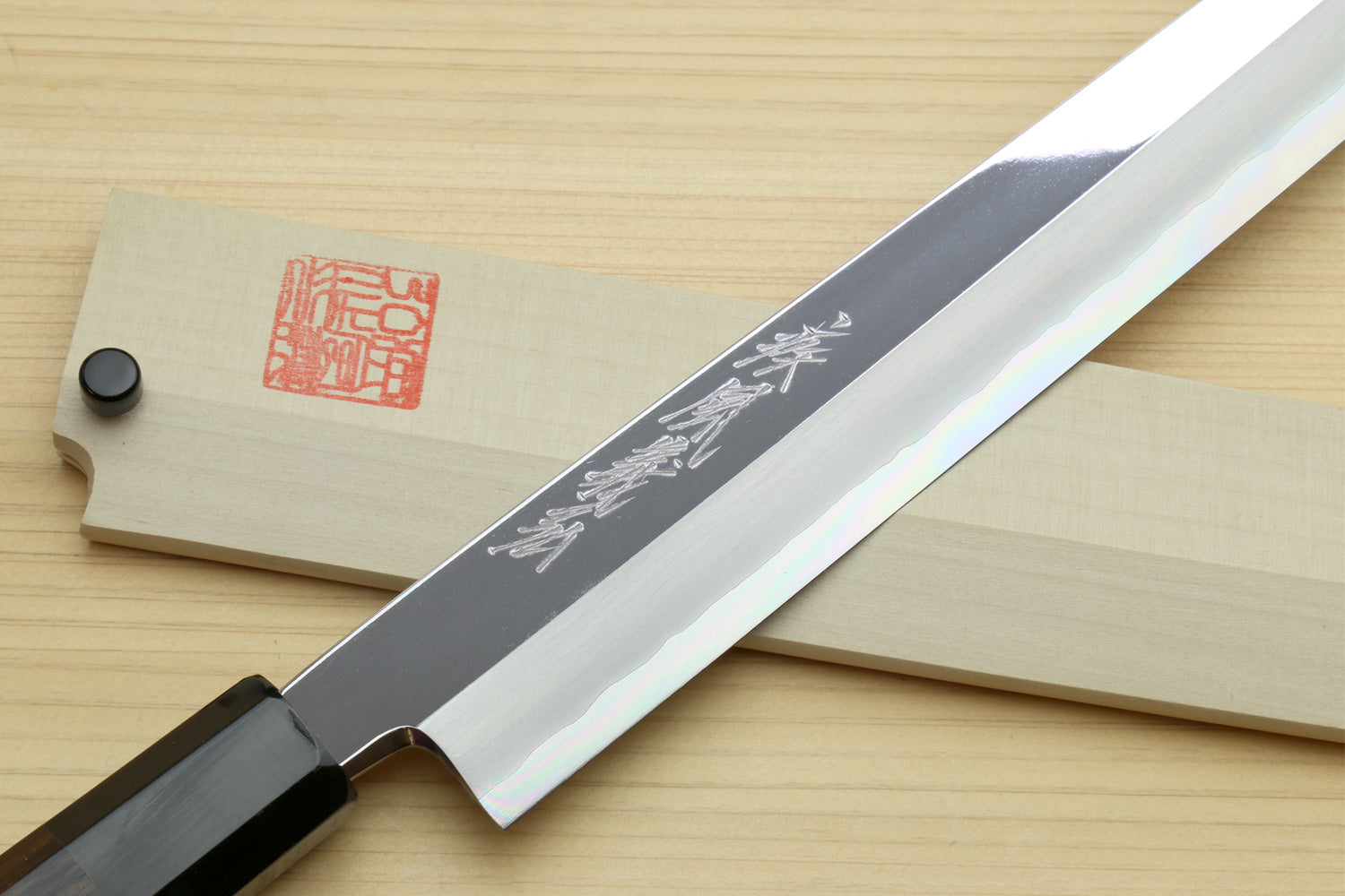Yanagi sashimi knife side view: mirror-polished blade with ebony handle