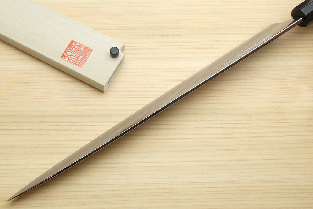 Yanagi sashimi knife profile view: ebony handle, mirror blade, sharp point