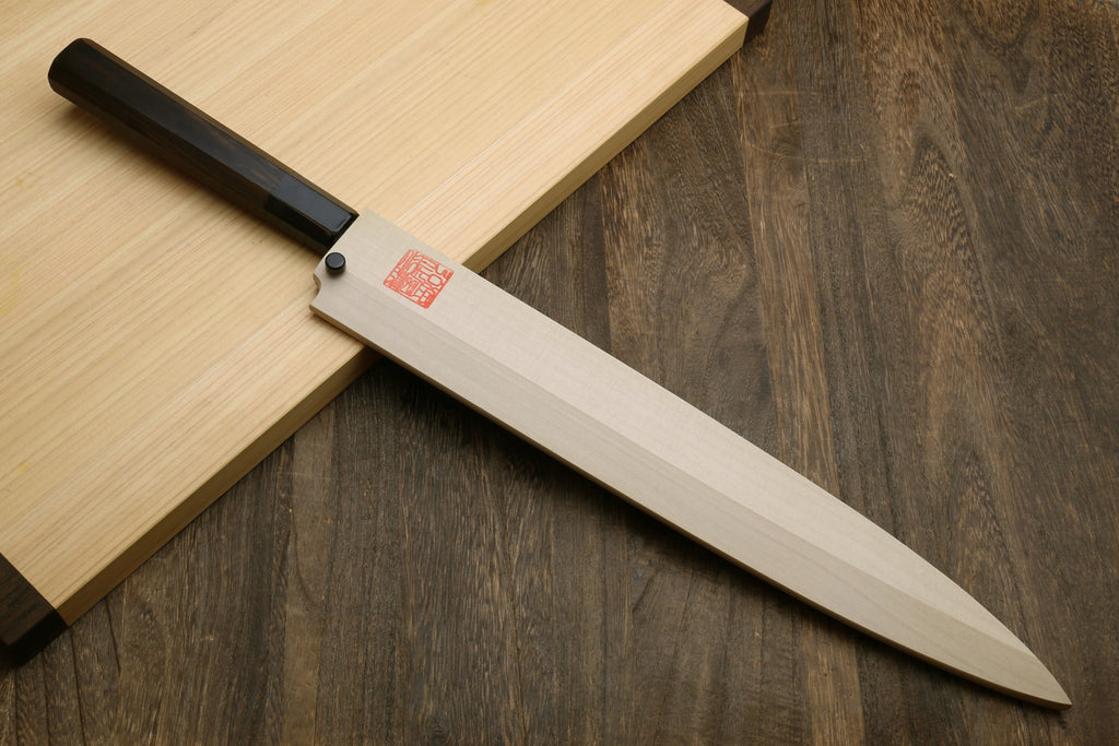 Yanagi sashimi knife angled view with mirror blade and ebony handle