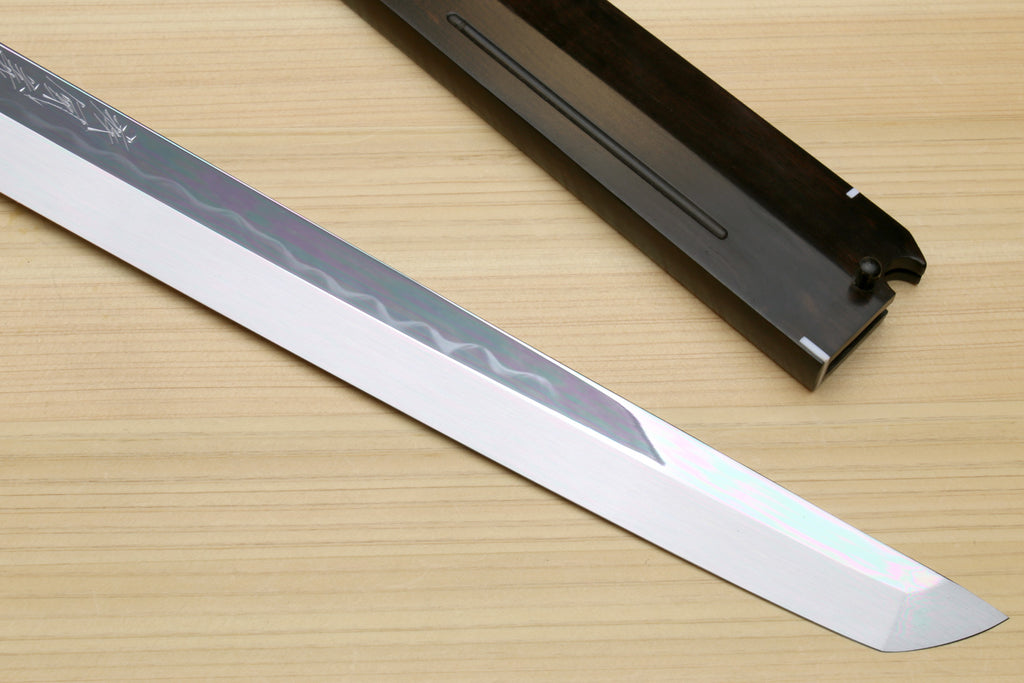 Japanese sushi knife blade with mirror-finished white steel and subtle wave pattern