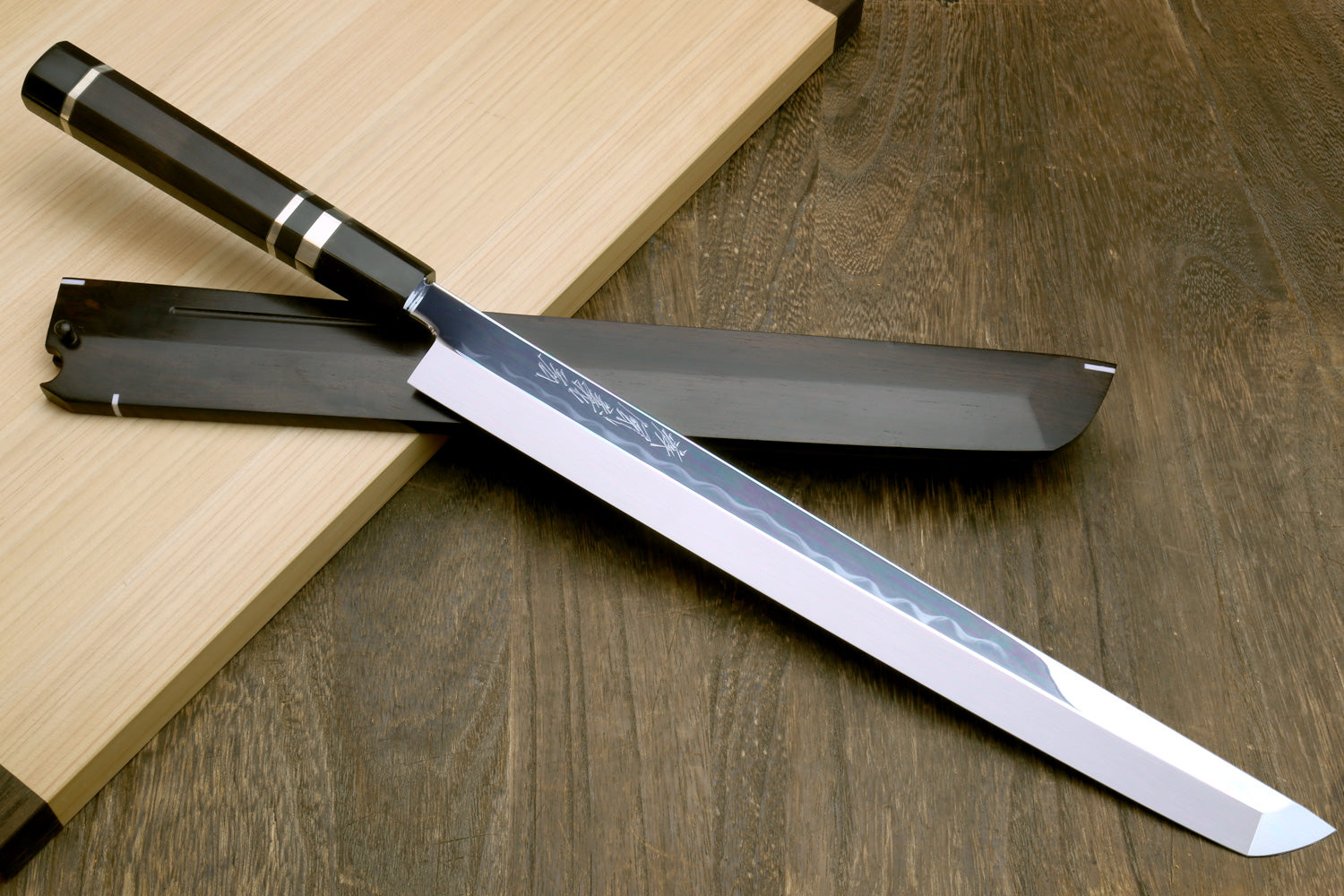 Japanese sushi knife with mirror-finished white steel blade, ebony handle and saya