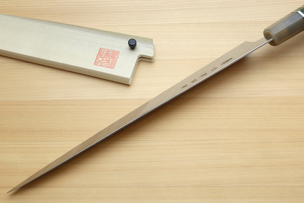 Sujihiki slicer knife with long silver blade and dark green handle