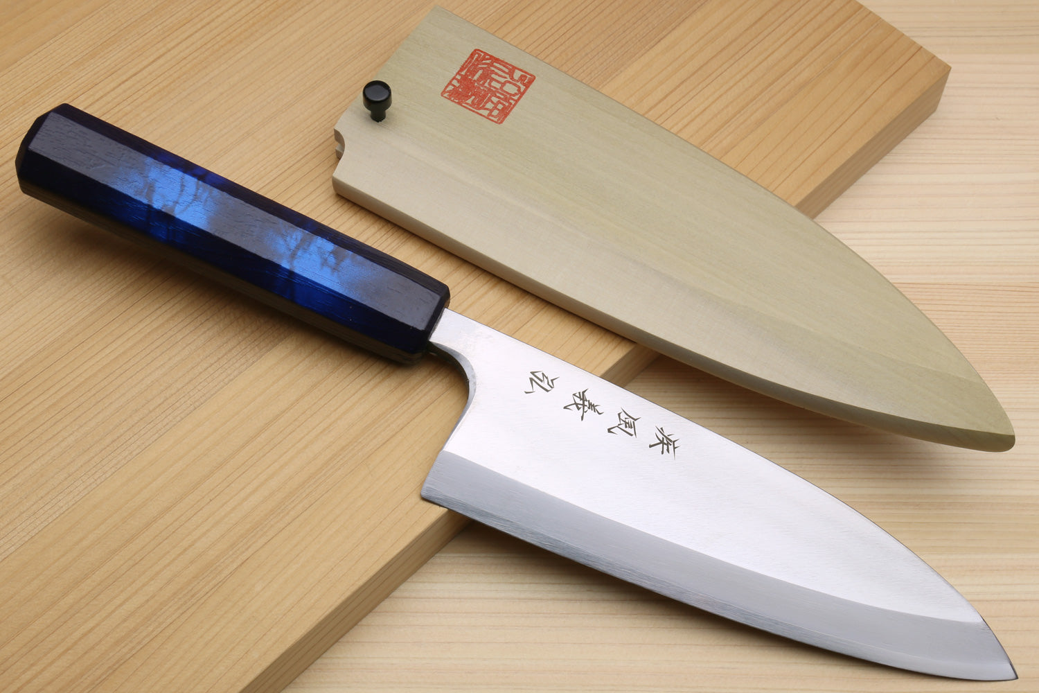 Japanese deba knife with stainless blade and dark blue handle