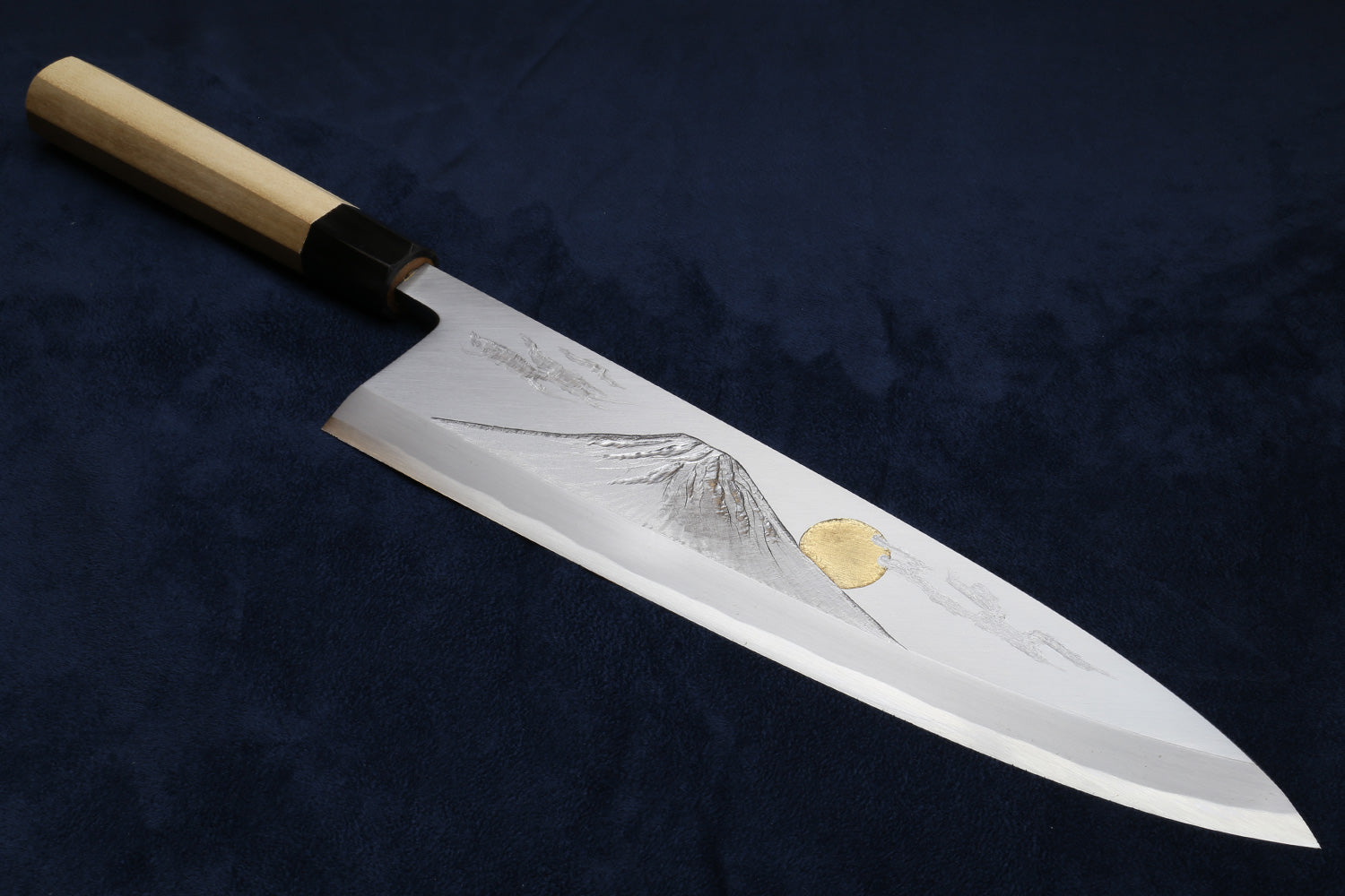 Deba fish fillet knife with white blade, gray etching, and gold medallion, wood handle