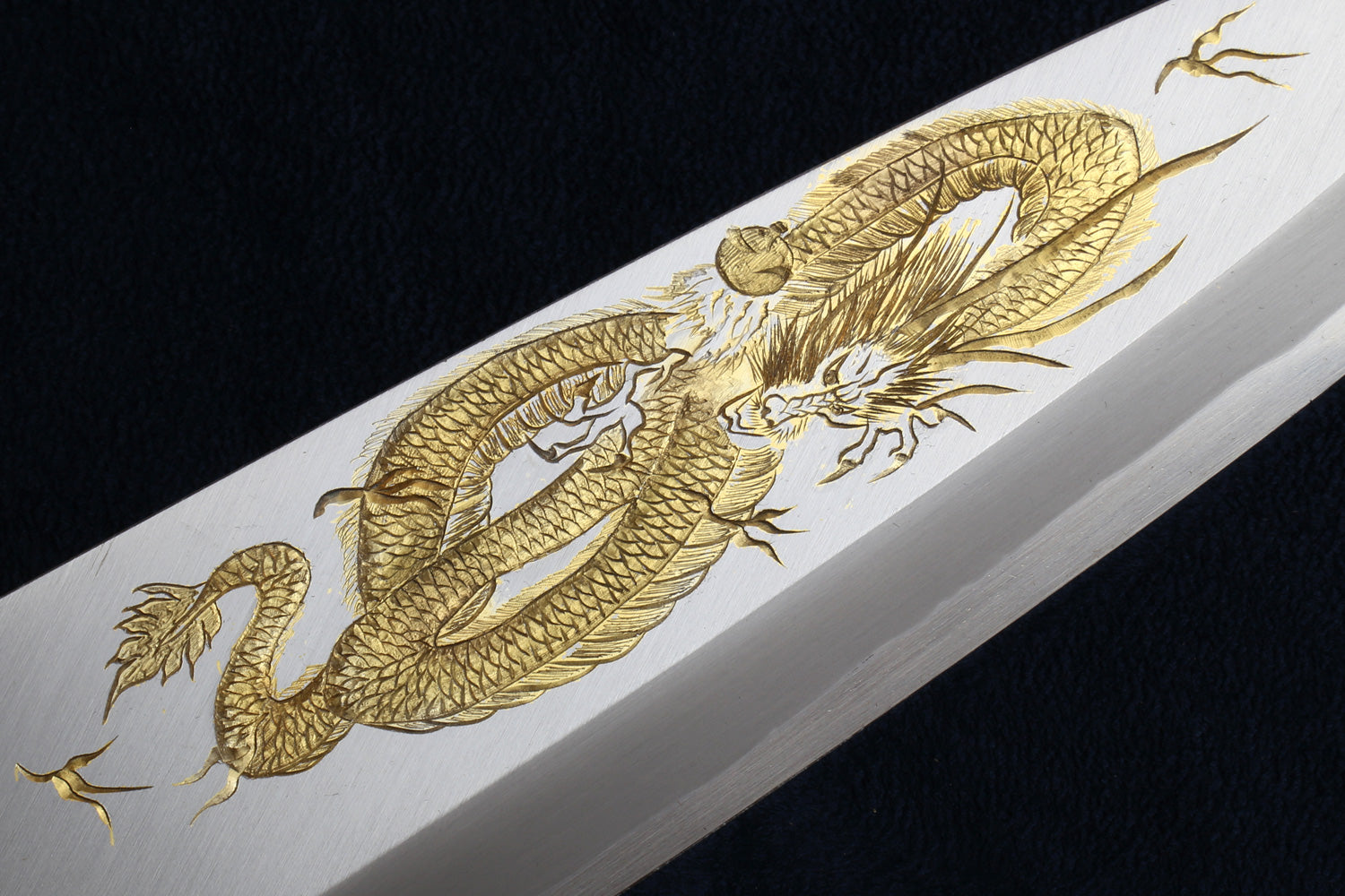 Deba fish fillet knife with white blade and ornate gold dragon etching, wood handle