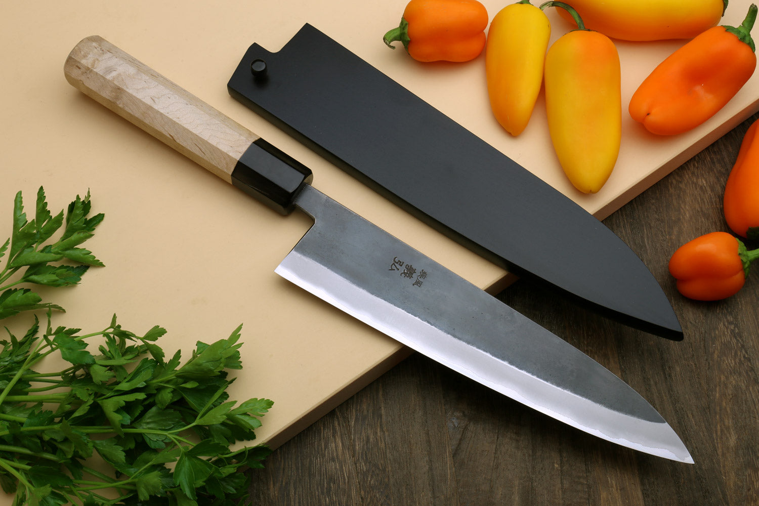 Gyuto chef knife with stainless clad blade and Kaede wood handle, black collar