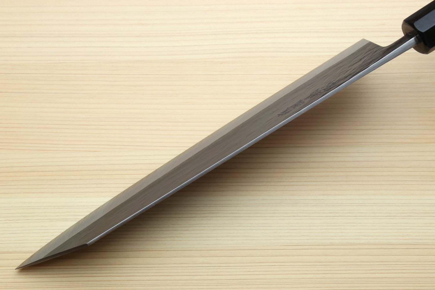 Kiritsuke chef knife side view, blue-gray blade and ebony handle