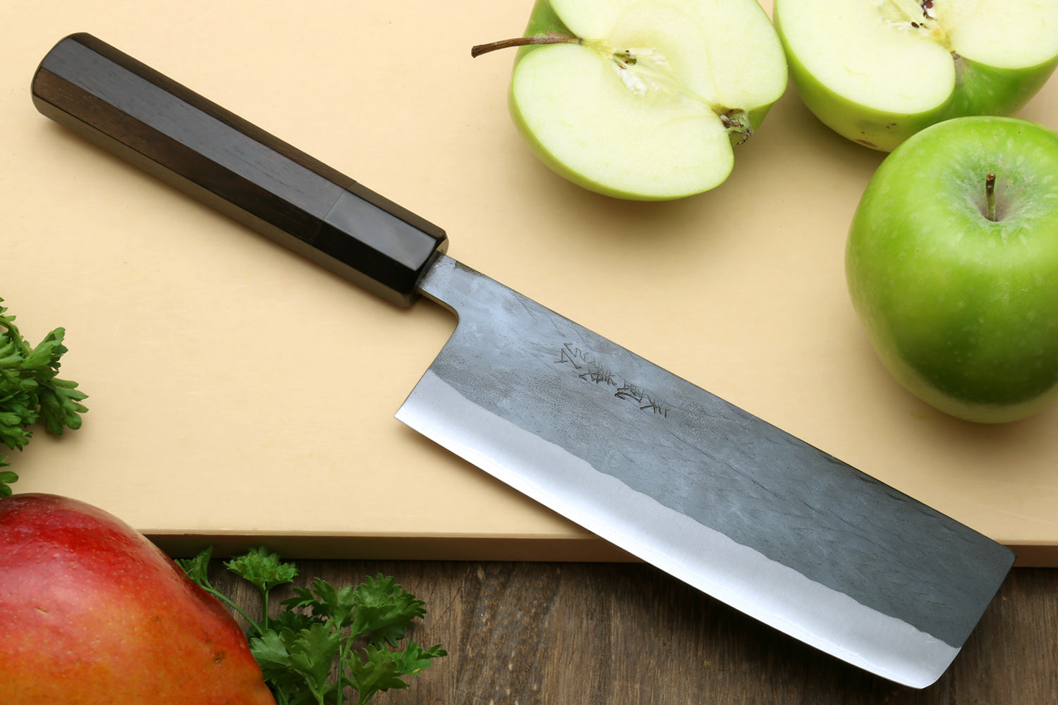 Nakiri vegetable knife with black ebony handle and blue-steel clad blade